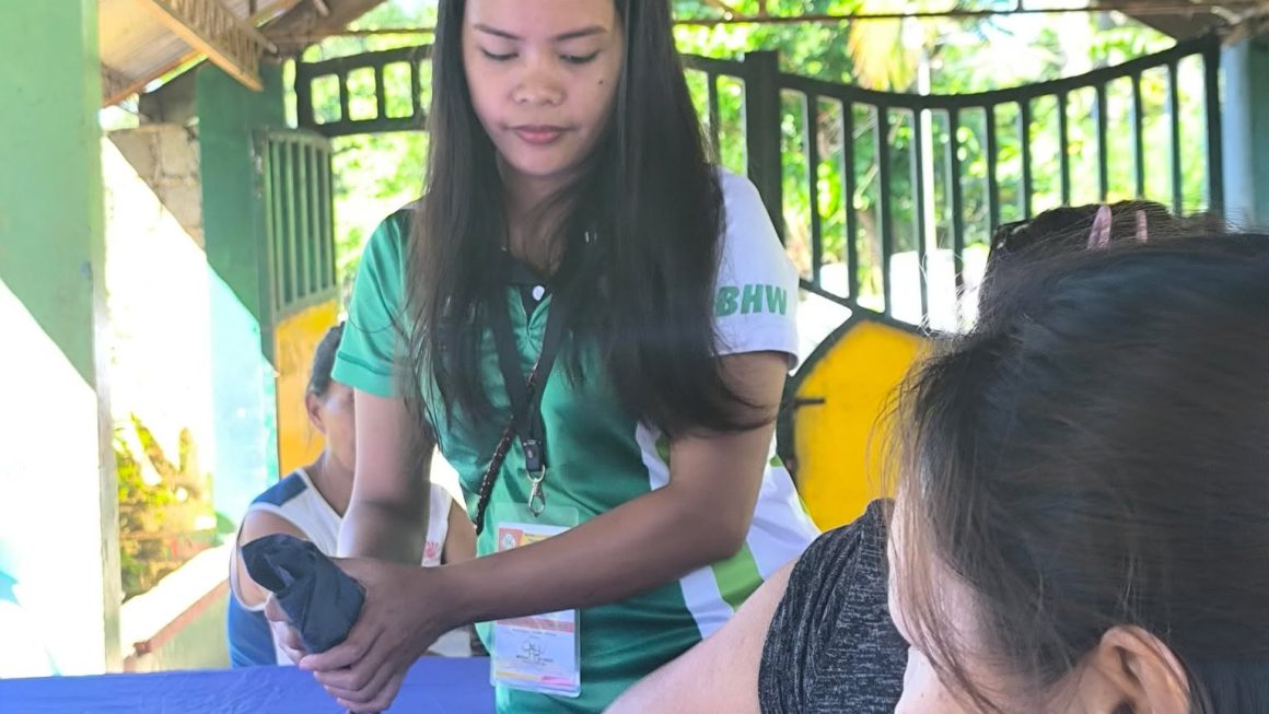 Village health volunteers conduct blood pressure check in Dologon, Maramag, Bukidnon