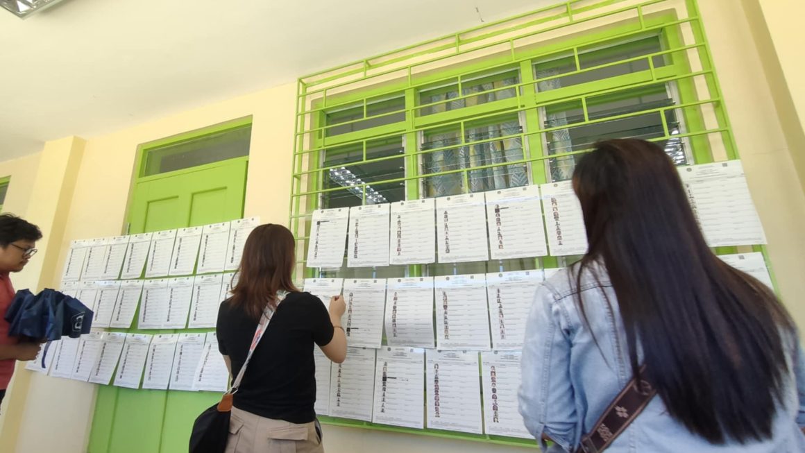 Brgy 6 voters search for their names in Malaybalay precinct